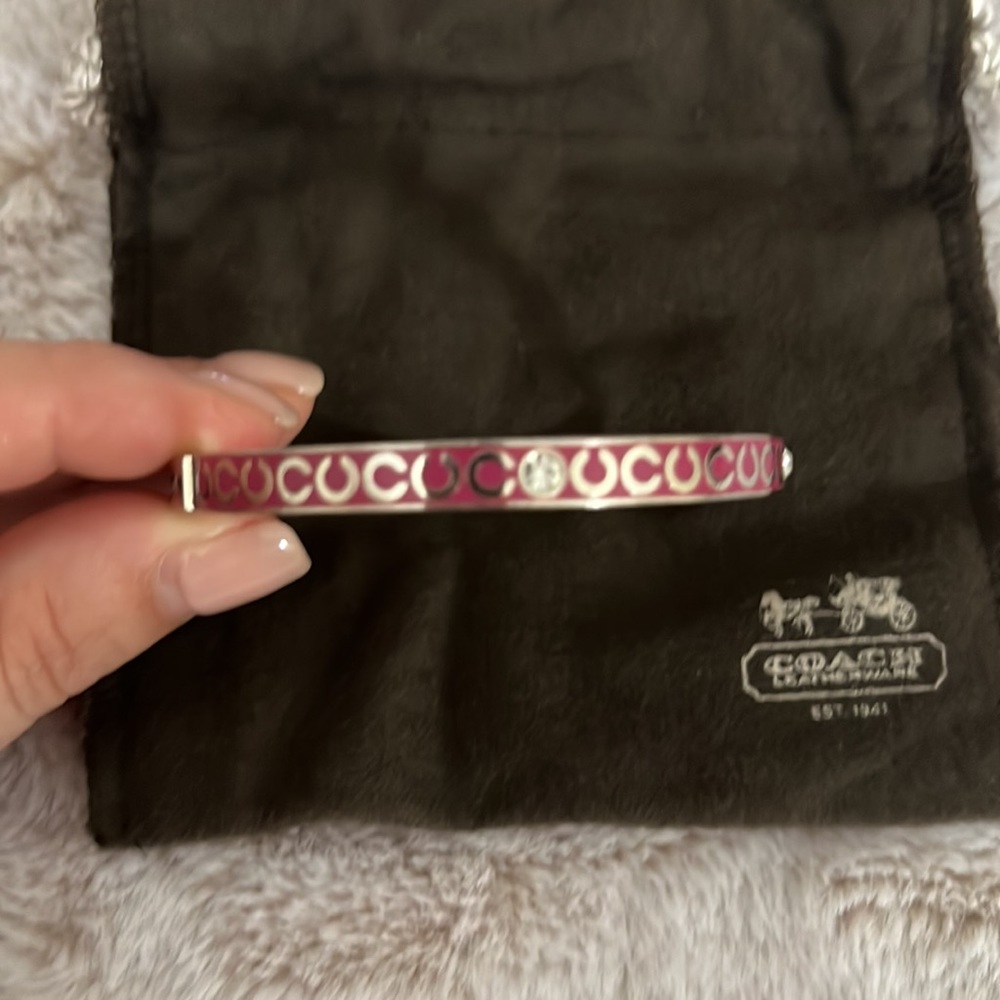 Coach pink rhinestone bangle. Dust bag included